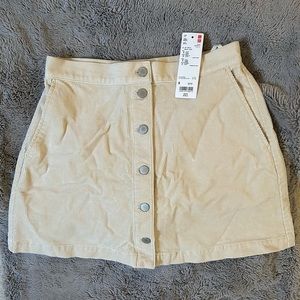 Two Corduroy Uniqlo Skirts. New with tags! Off White & Dark Green.